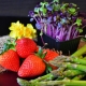 edible plants with strawberries, asparagus and sprouts